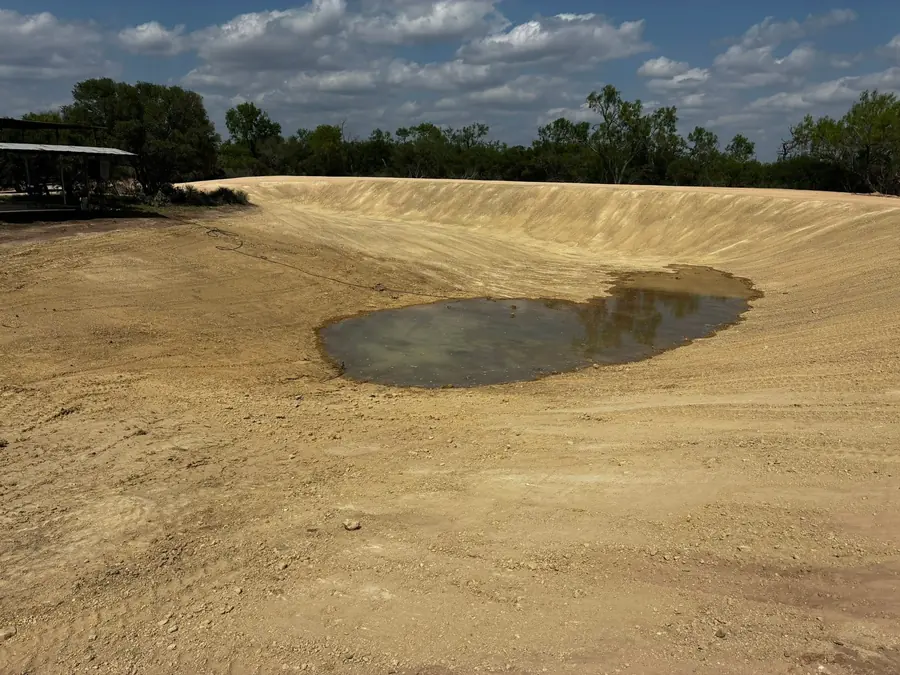 Large excavated tank basin with smooth graded banks
